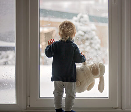 little boy inside during winter